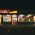 A fast food restaurant with neon lights at night in Houston, Texas.