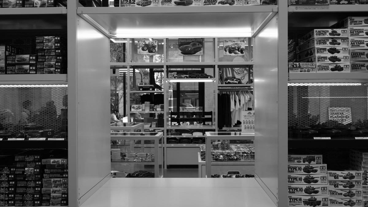 Interior view of a model kit store showing shelves filled with boxes of model kits.