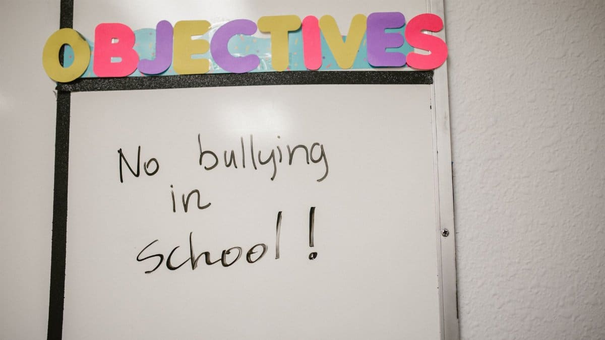 Whiteboard with 'No bullying in school!' message promoting anti-bullying awareness.