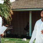 A real estate agent showing a house to a couple, discussing options.