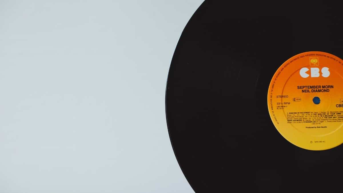 A close-up of a vintage vinyl record with CBS label on a white background.