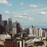 Breathtaking view of Seattle's iconic skyline with the Space Needle and Mount Rainier in the background.