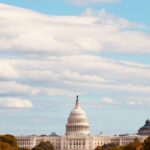 The United States Capitol with a clear blue sky and fall foliage, Washington D.C.