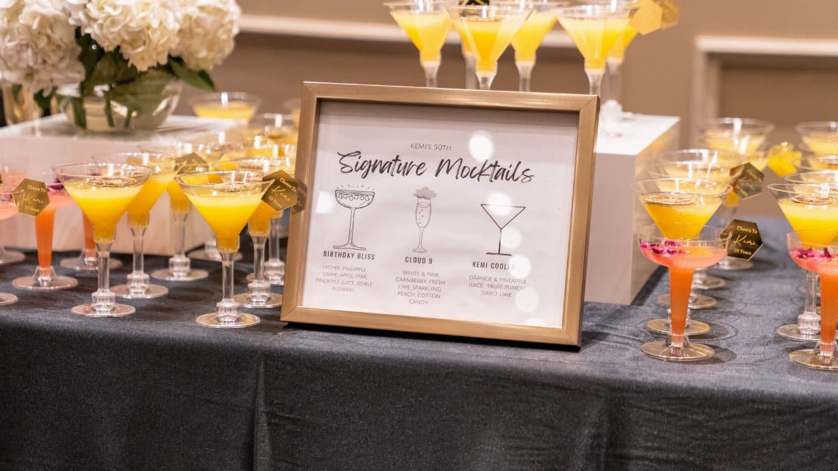Vibrant selection of signature mocktails on display at a sophisticated indoor event.