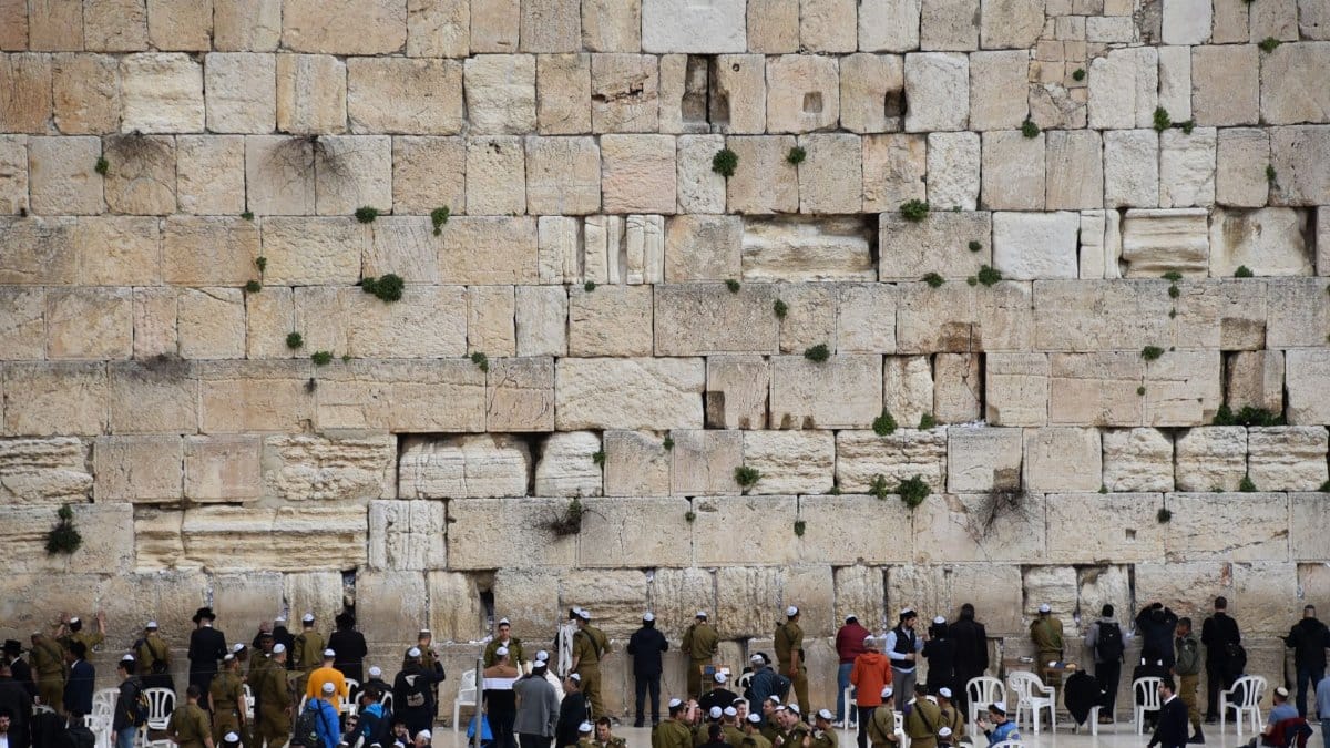 People gathering at the Western Wall, a sacred site in Jerusalem.