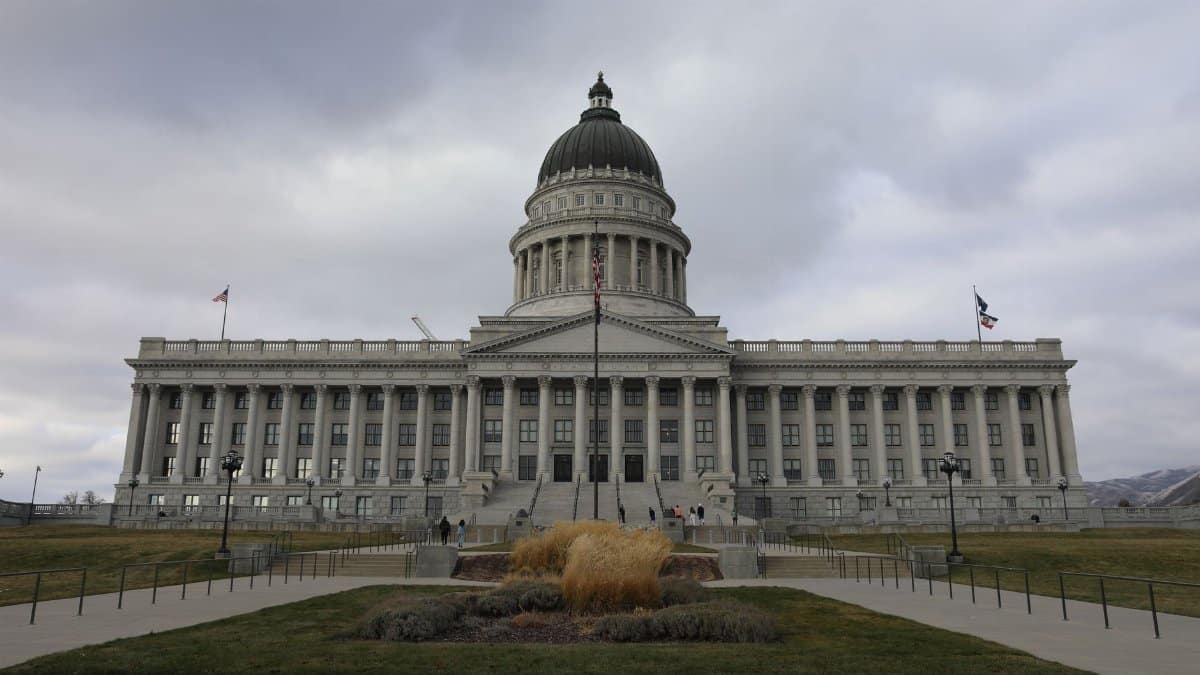 Front view of the Utah State Capitol in Salt Lake City under cloudy skies.