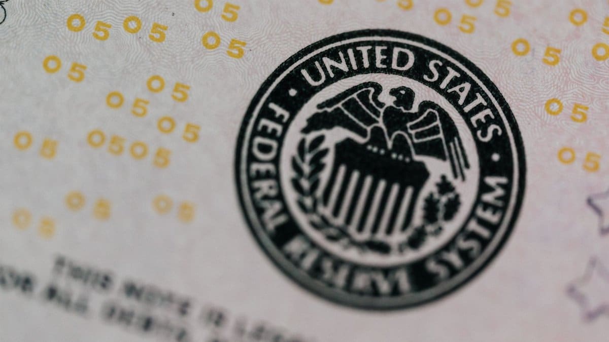 From above eagle on antique column in circle on banknote of Unites States placed on table