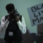 A photojournalist capturing a pivotal moment at a Black Lives Matter protest.
