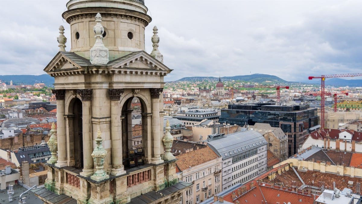 Captivating aerial shot of St. Stephen's Basilica tower in Budapest cityscape.