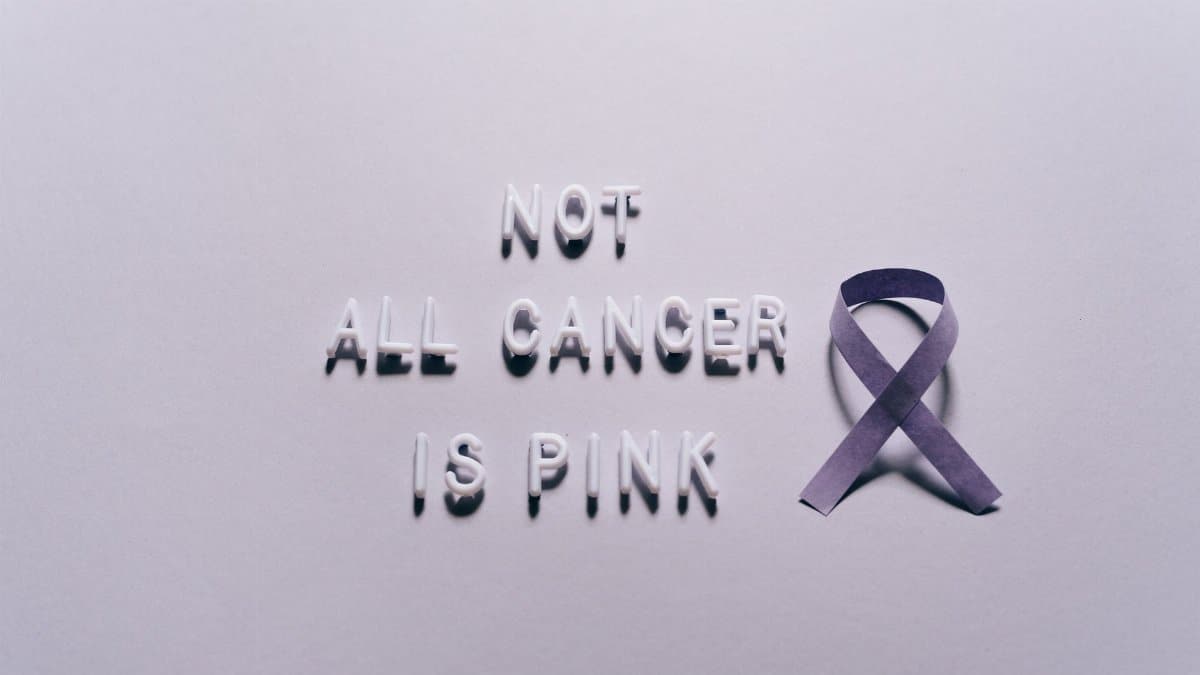 Purple ribbon with 'Not All Cancer is Pink' text symbolizing awareness for various cancer types.