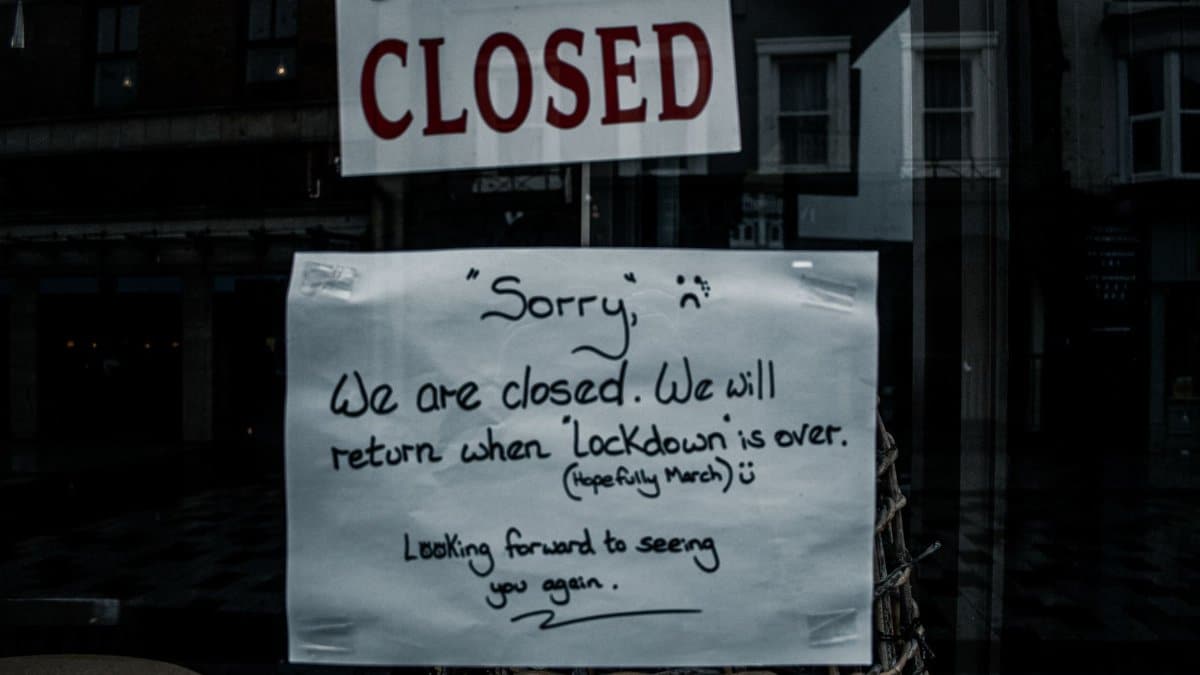 A shop window in Darlington, England displays a closed sign due to lockdown.