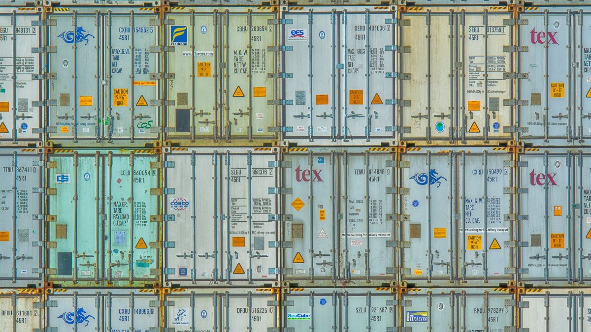 A vibrant display of stacked shipping containers, highlighting industrial organization.