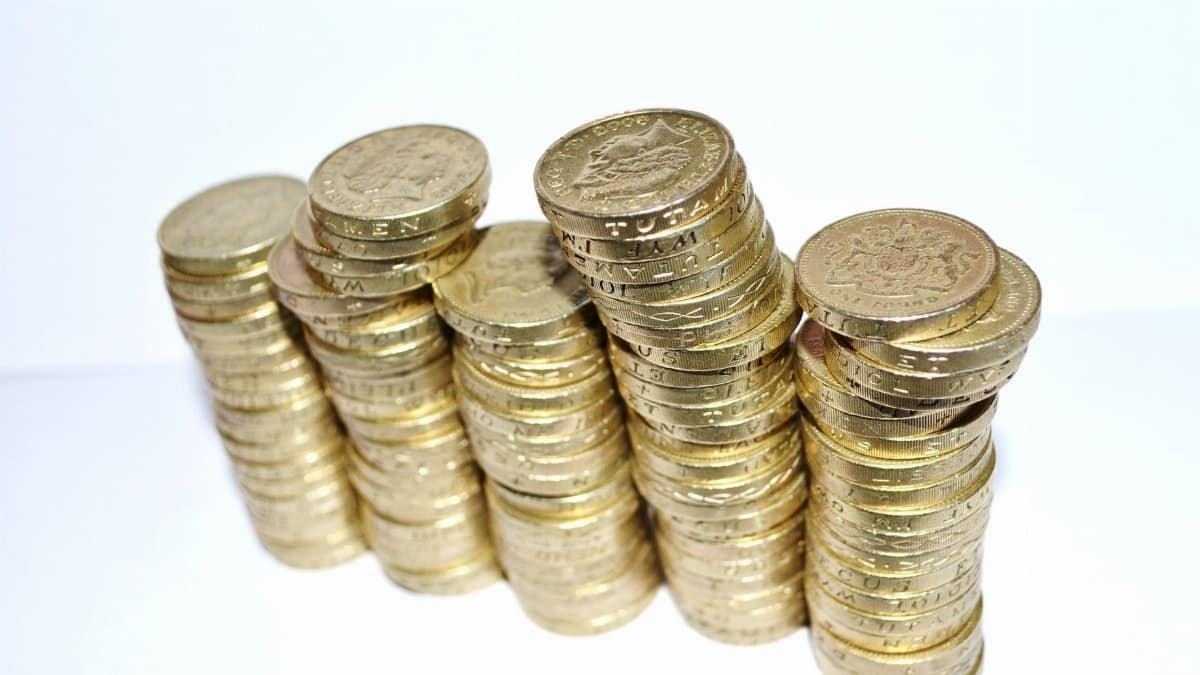 Close-up of stacked gold coins symbolizing wealth and financial growth.