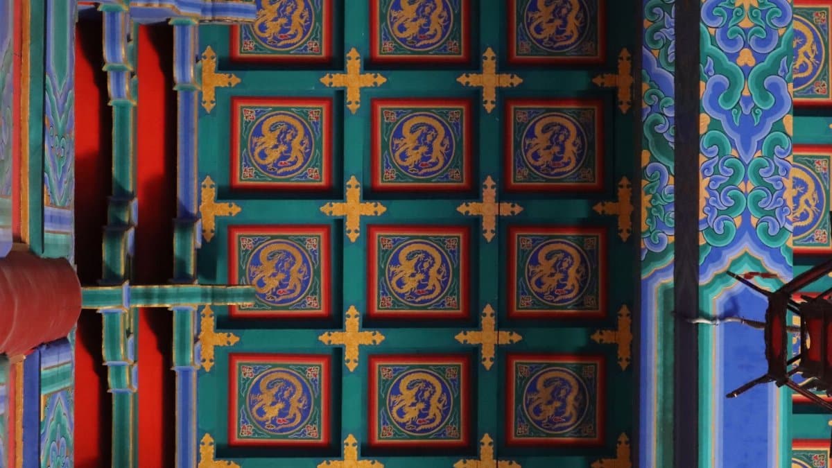 Colorful oriental ceiling with detailed dragon motifs and traditional patterns.