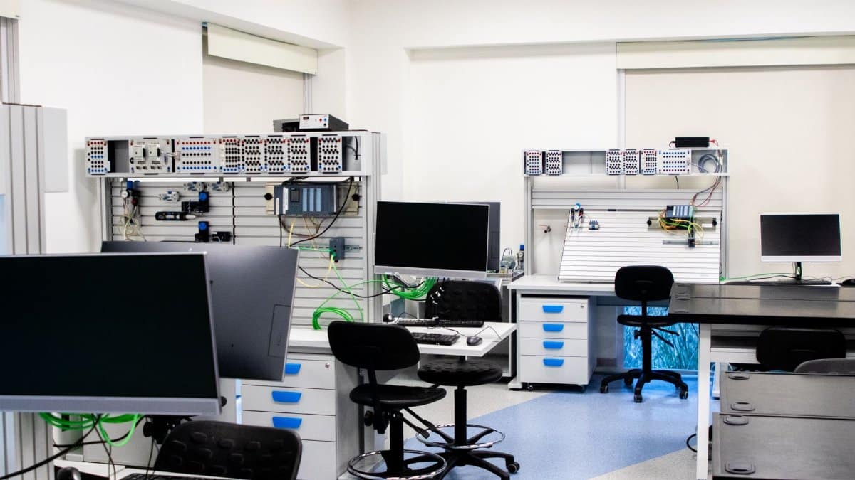 Bright modern laboratory with computers and technical equipment for research and analysis.