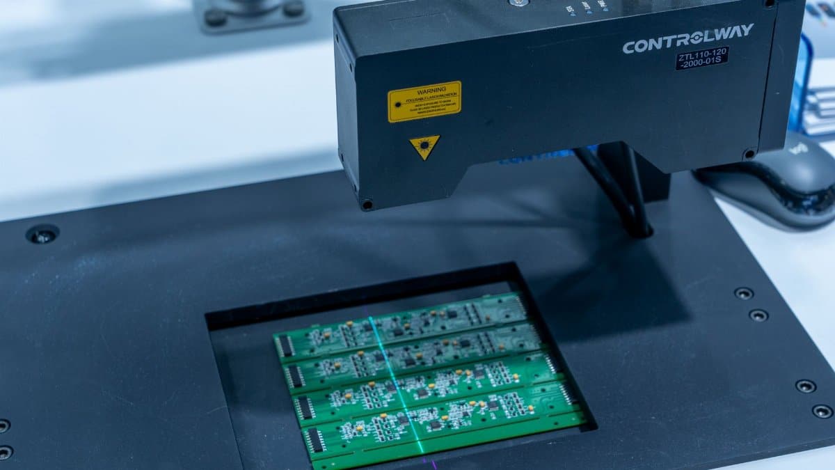 Close-up of a PCB inspection machine in action, highlighting technology.