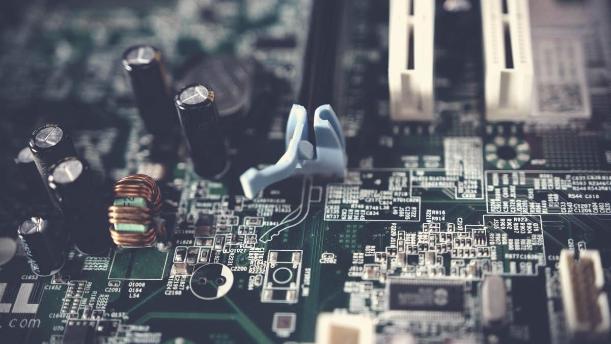 Detailed view of components on a computer motherboard, showcasing technology and circuitry.