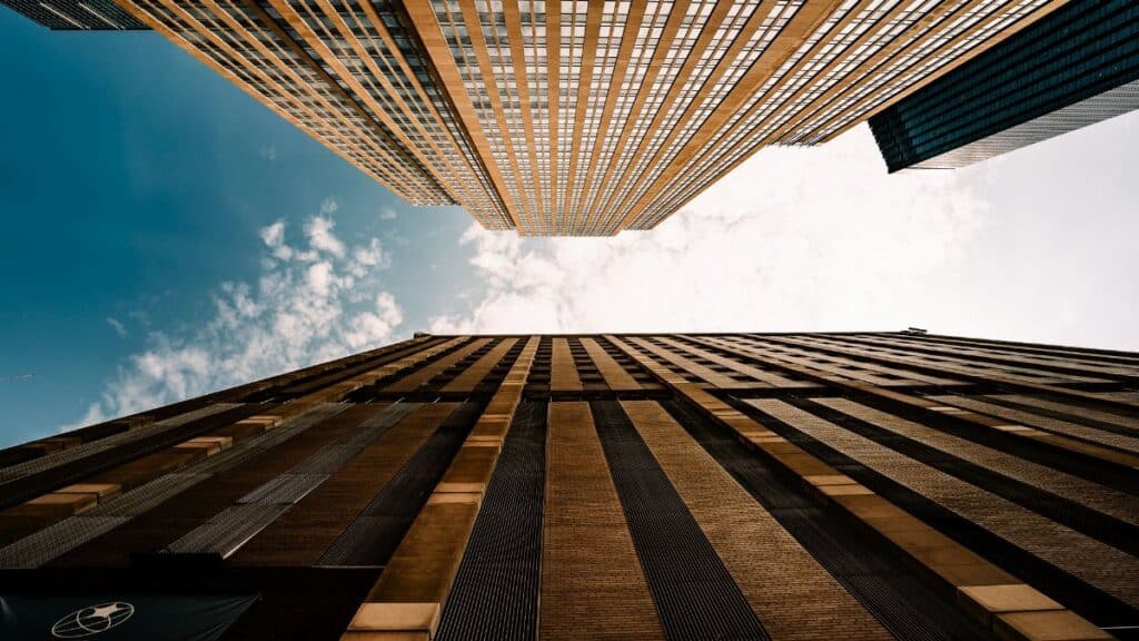 Dramatic upward view of skyscrapers against a blue sky in Minneapolis, Minnesota.