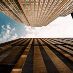 Dramatic upward view of skyscrapers against a blue sky in Minneapolis, Minnesota.