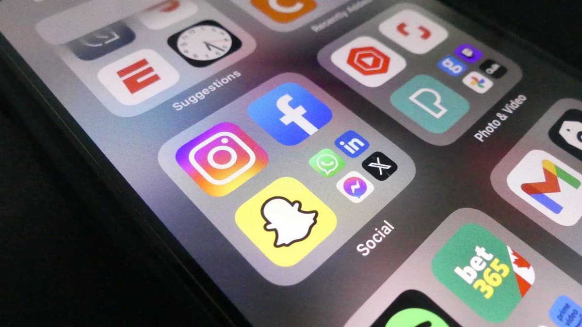 Close-up view of a smartphone screen featuring popular social media application icons.