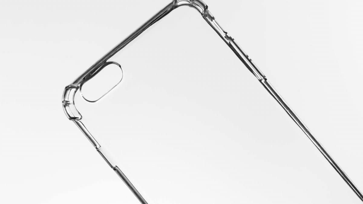 Close-up of a transparent phone case against a light background, showcasing sleek design.