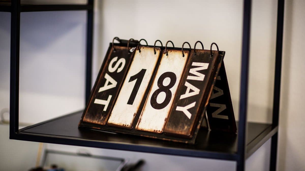 Rustic vintage calendar showing May 18th, perfect for antique decor aesthetics.