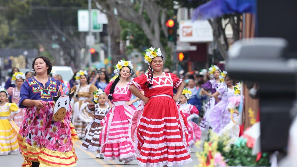 Vibrant cultural festival with traditional dancers parading in colorful costumes in San Francisco.