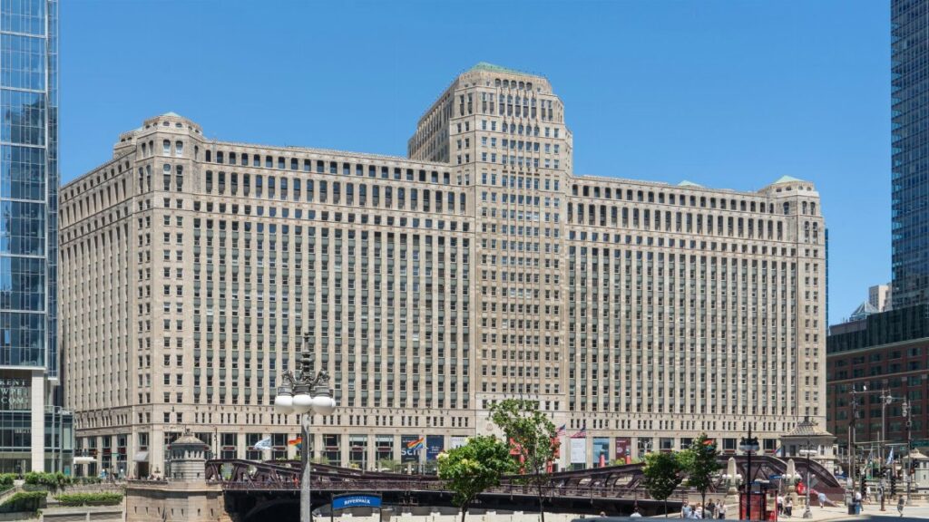 A daylight view of the iconic Merchandise Mart building in downtown Chicago, featuring its classic architecture.