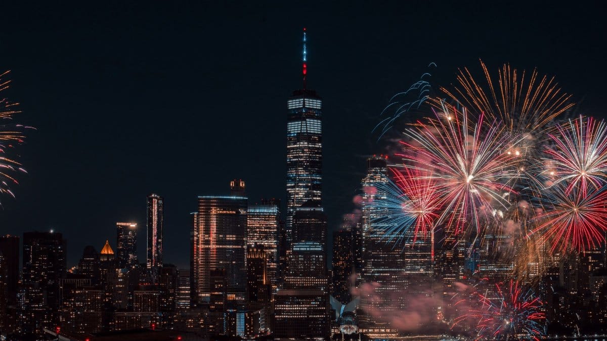 Colorful fireworks illuminating the New York City skyline at night, capturing a vibrant celebration.