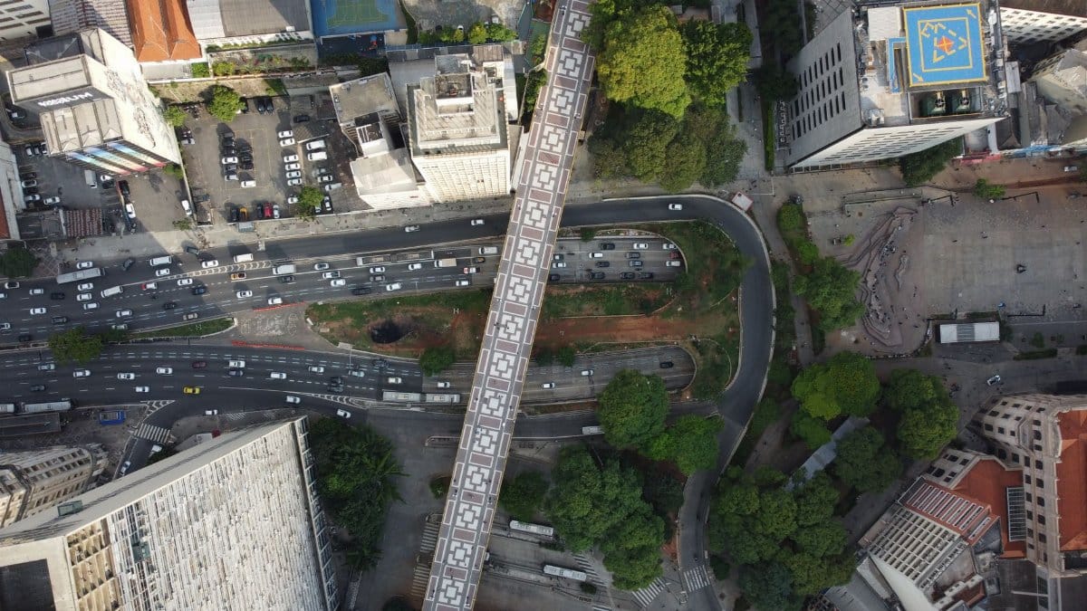High-angle aerial shot of São Paulo, Brazil, showcasing urban traffic and buildings.