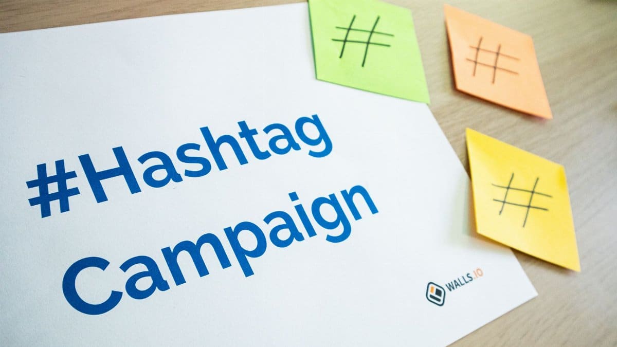 An organized workspace with hashtag campaign materials and colorful sticky notes.