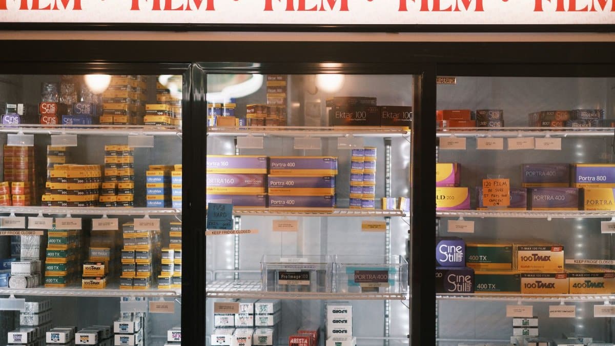 Photographic film stocked in a refrigerated display at a store.