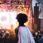 Vibrant outdoor music festival in Casablanca, Morocco with a lively crowd and colorful stage lights.