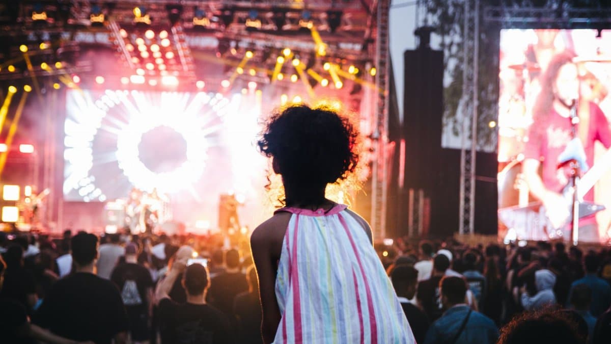 Vibrant outdoor music festival in Casablanca, Morocco with a lively crowd and colorful stage lights.