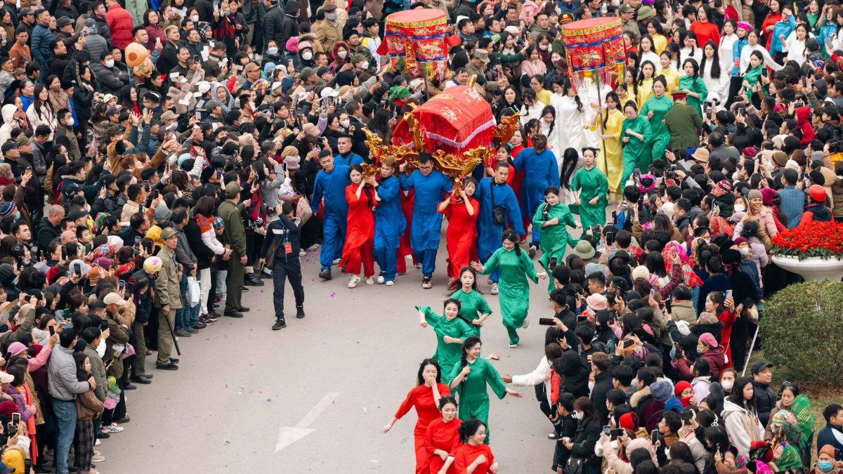 A lively scene from the Ky Cung Ta Phu Temple Festival in Lạng Sơn, Vietnam, showcasing cultural traditions.