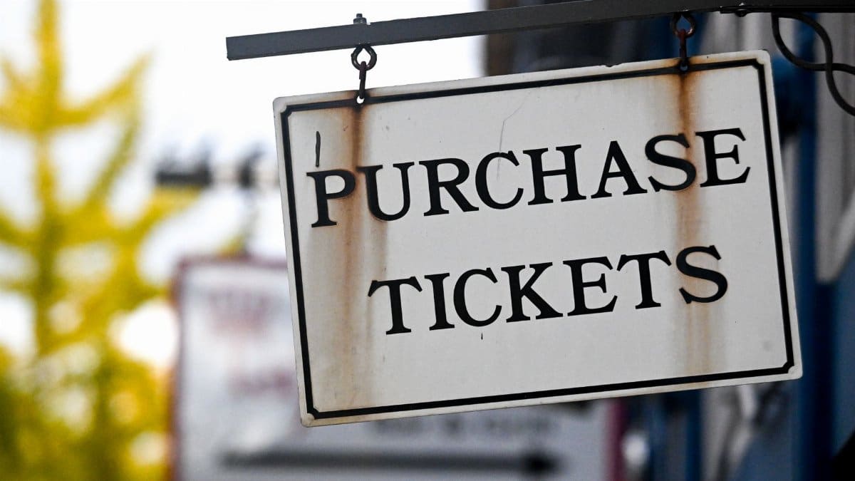Close-up of a vintage 'Purchase Tickets' sign in Covington, Kentucky.