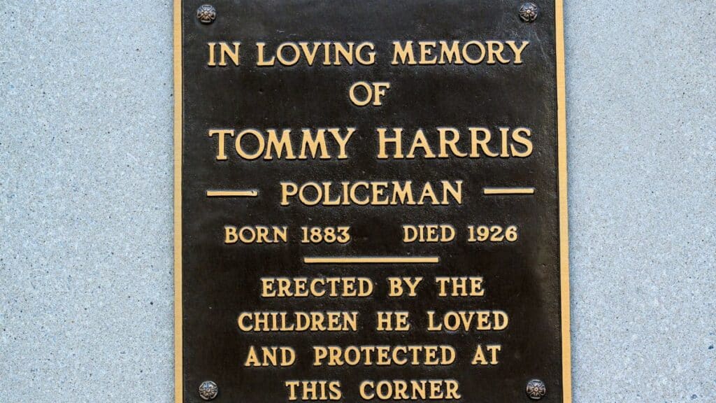 Bronze plaque in memory of Tommy Harris, erected by local children in Covington, KY.