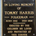 Bronze plaque in memory of Tommy Harris, erected by local children in Covington, KY.