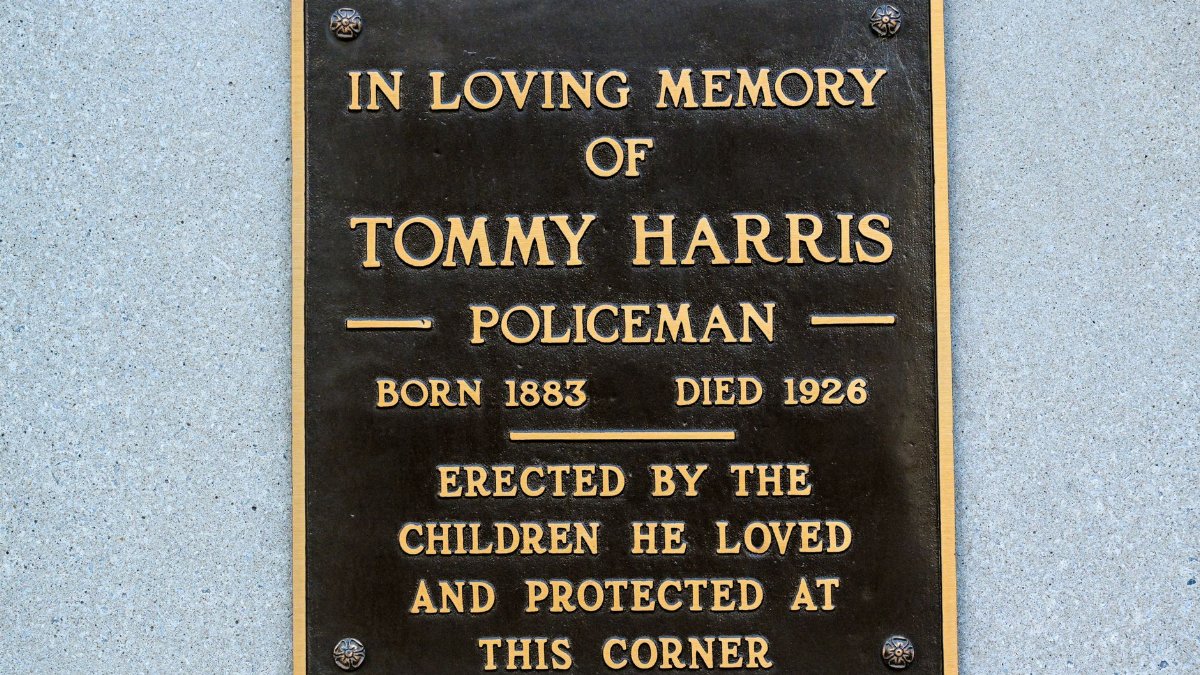 Bronze plaque in memory of Tommy Harris, erected by local children in Covington, KY.