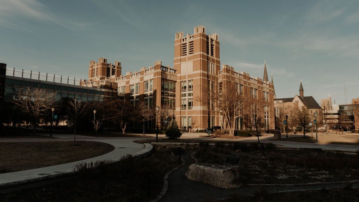 A historic campus building with classic architecture in Milwaukee, Wisconsin, under a clear sky.