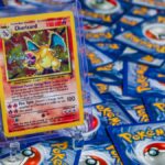 High-value Charizard Pokémon trading card surrounded by various other cards.
