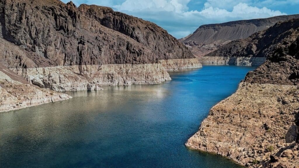 Breathtaking aerial view of the Colorado River cutting through the rocky canyons, offering a mesmerizing natural landscape.