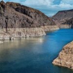 Breathtaking aerial view of the Colorado River cutting through the rocky canyons, offering a mesmerizing natural landscape.