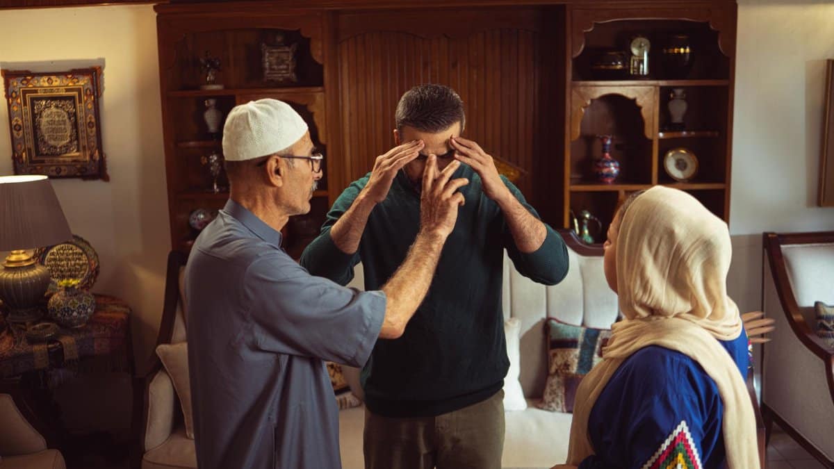 A family discussion taking place in an ornate and traditional home environment, showcasing cultural elements.