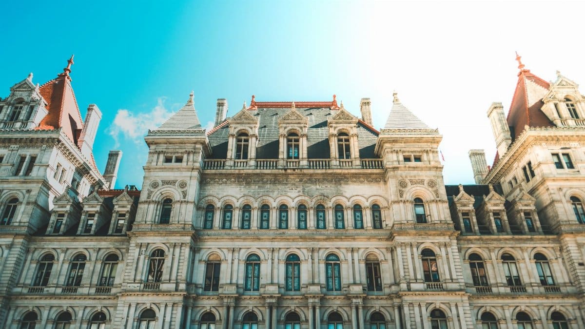 Elegant Renaissance architecture of the New York State Capitol building in Albany under clear sky.