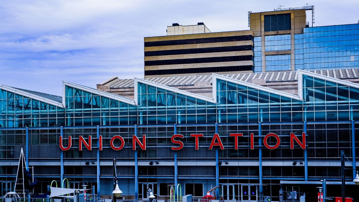 Exterior view of Union Station in Kansas City showcasing modern glass architecture and vibrant cityscape.