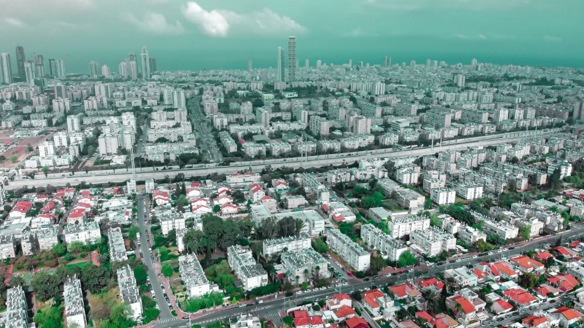 Drone view of Holon cityscape in Israel showcasing buildings and streets in a vibrant urban setting.