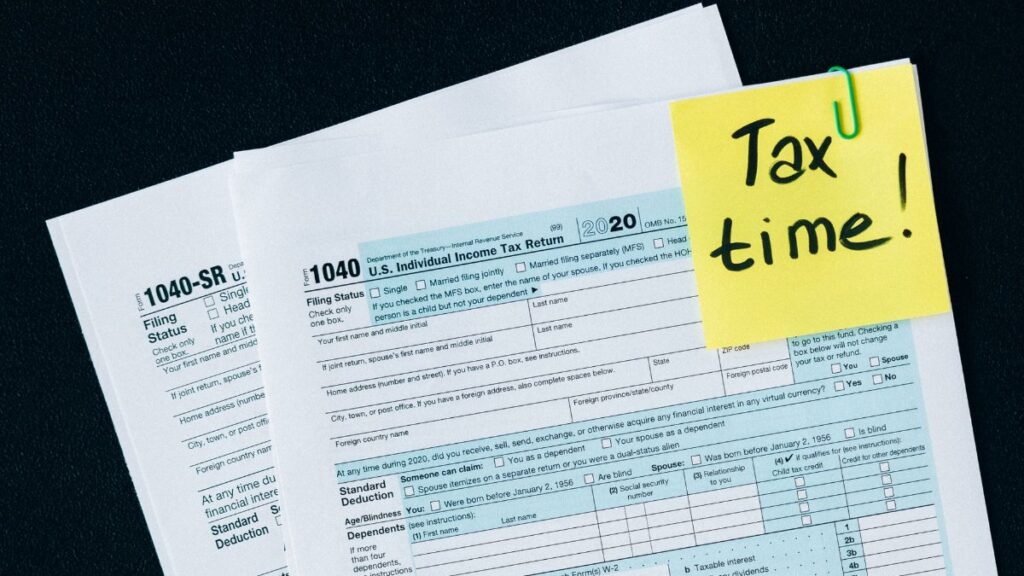U.S. tax documents with a 'Tax time!' reminder, highlighting the importance of filing deadlines.