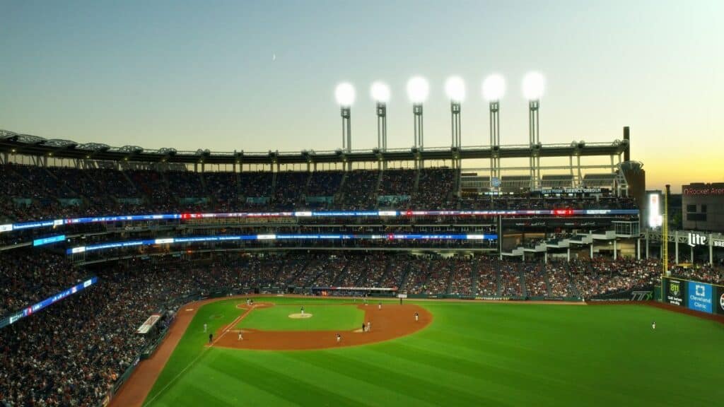 A vibrant twilight baseball game at Cleveland's Progressive Field, capturing the lively atmosphere.