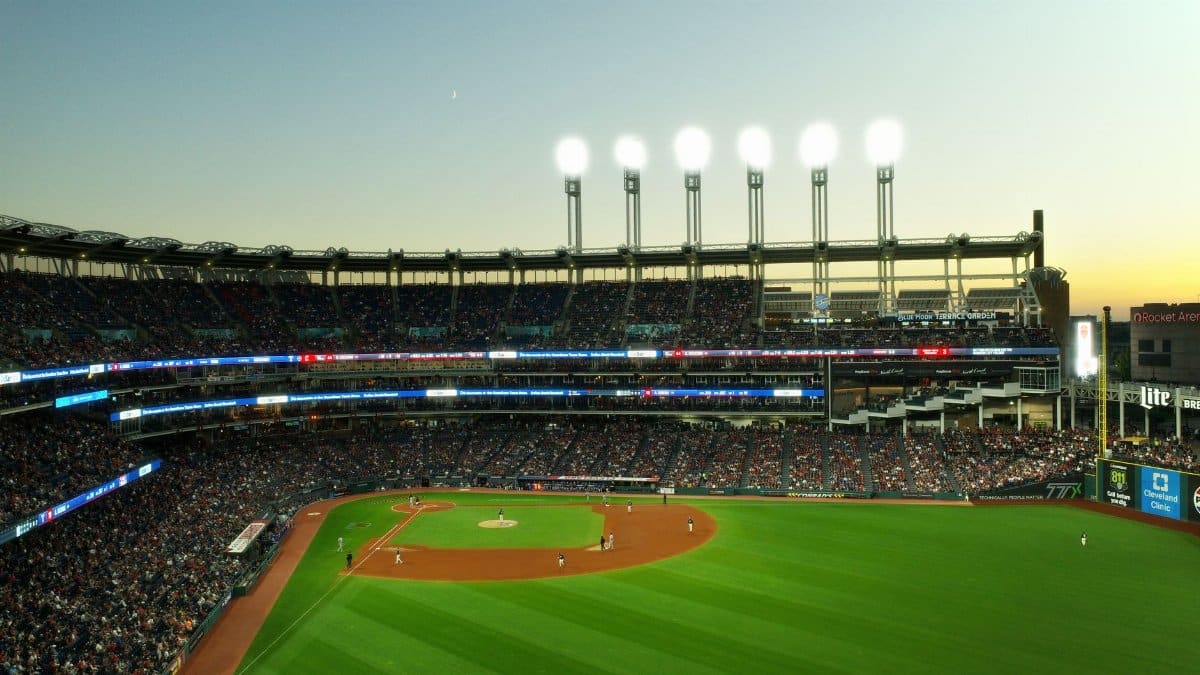 A vibrant twilight baseball game at Cleveland's Progressive Field, capturing the lively atmosphere.
